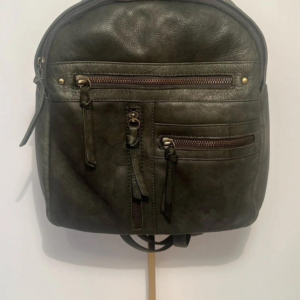 Green Backpack with Rugged Design and Leather Material